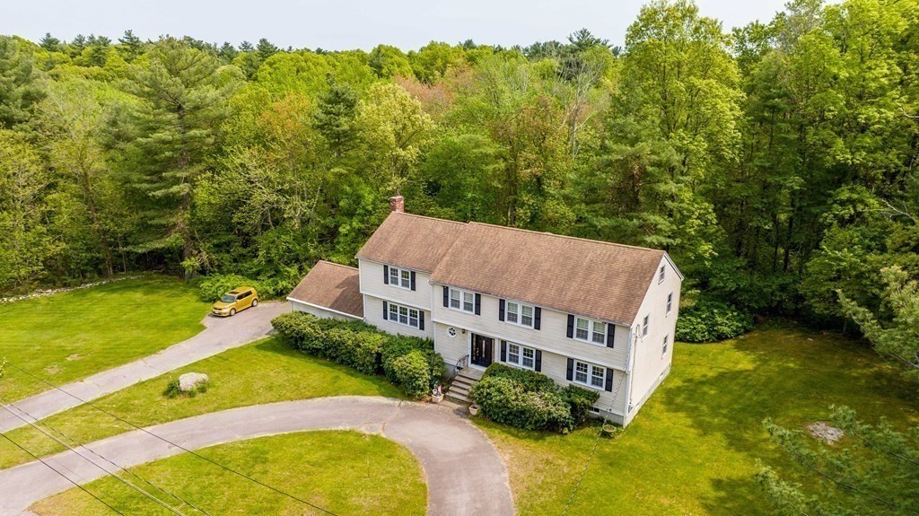 5 Chief Lane Canton, MA 02021 - Photo 6 of 42 a view of a house with pool and a yard