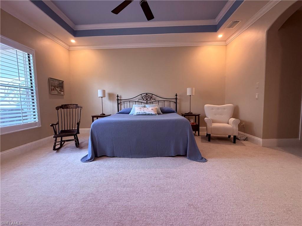 7543 Moorgate Point Way Naples, FL 34113 - Photo 20 of 31 a bedroom with a bed and a chair