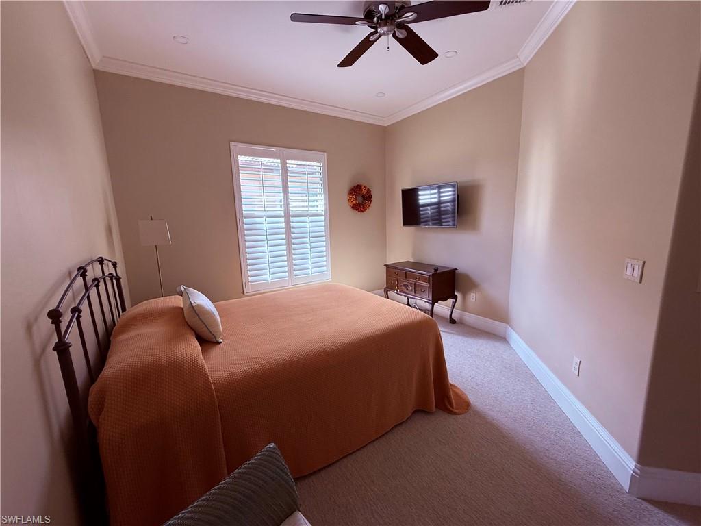 7543 Moorgate Point Way Naples, FL 34113 - Photo 25 of 31 a bedroom with a bed and window