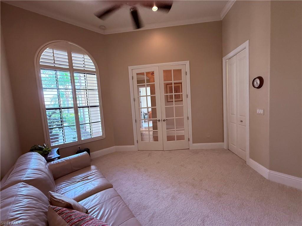 7543 Moorgate Point Way Naples, FL 34113 - Photo 27 of 31 a living room with furniture and a window