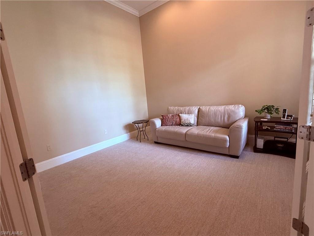 7543 Moorgate Point Way Naples, FL 34113 - Photo 28 of 31 a living room with furniture