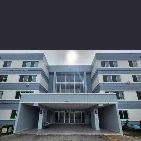 a front view of a building with glass windows