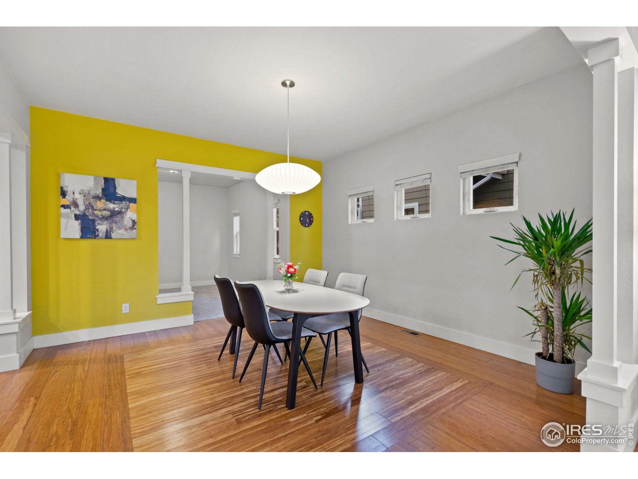 2263 Bellwether Lane Fort Collins, CO 80521 - Photo 13 of 40 a view of a dining room with furniture and wooden floor