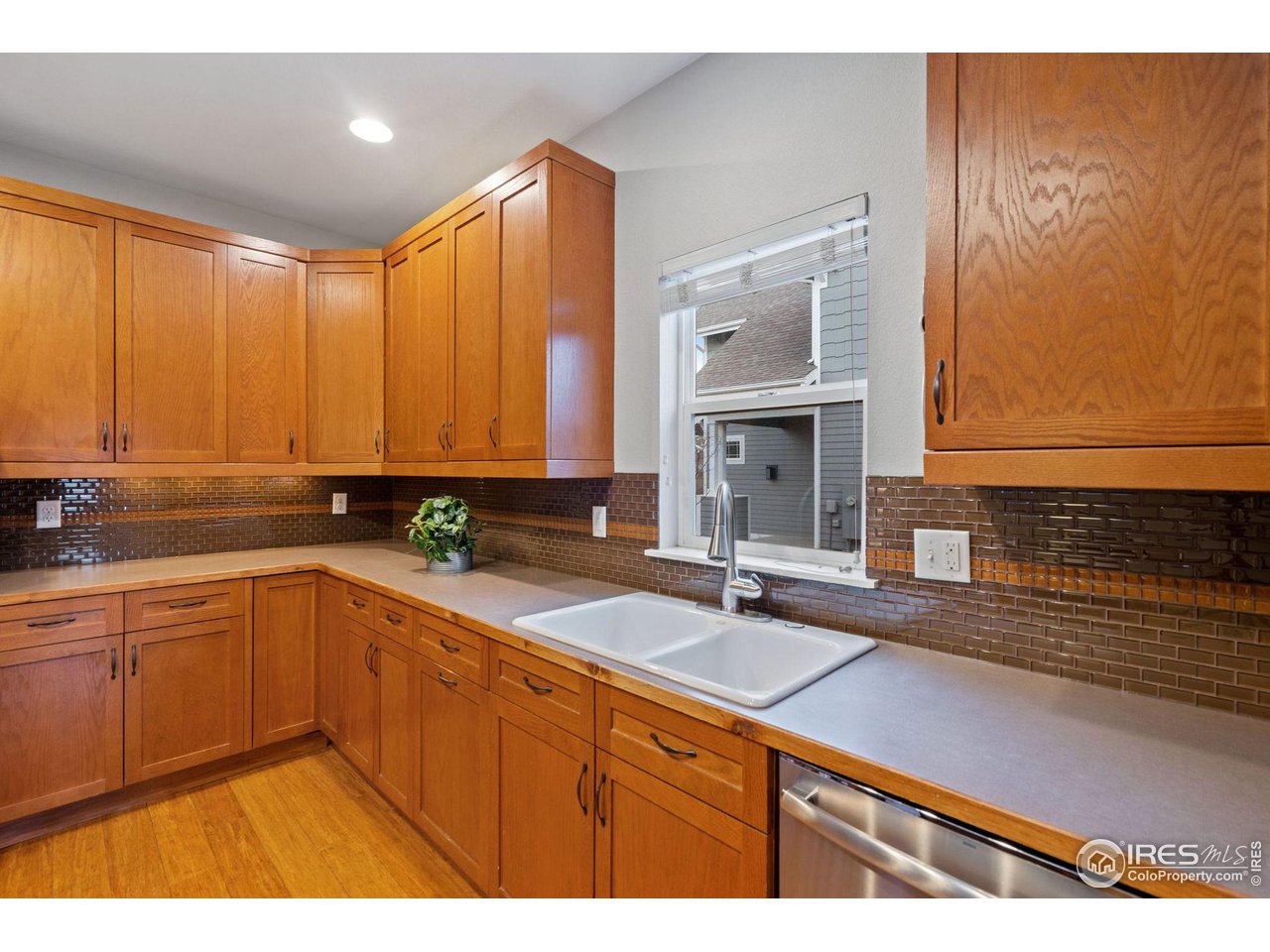 2263 Bellwether Lane Fort Collins, CO 80521 - Photo 14 of 40 a kitchen with a sink and cabinets
