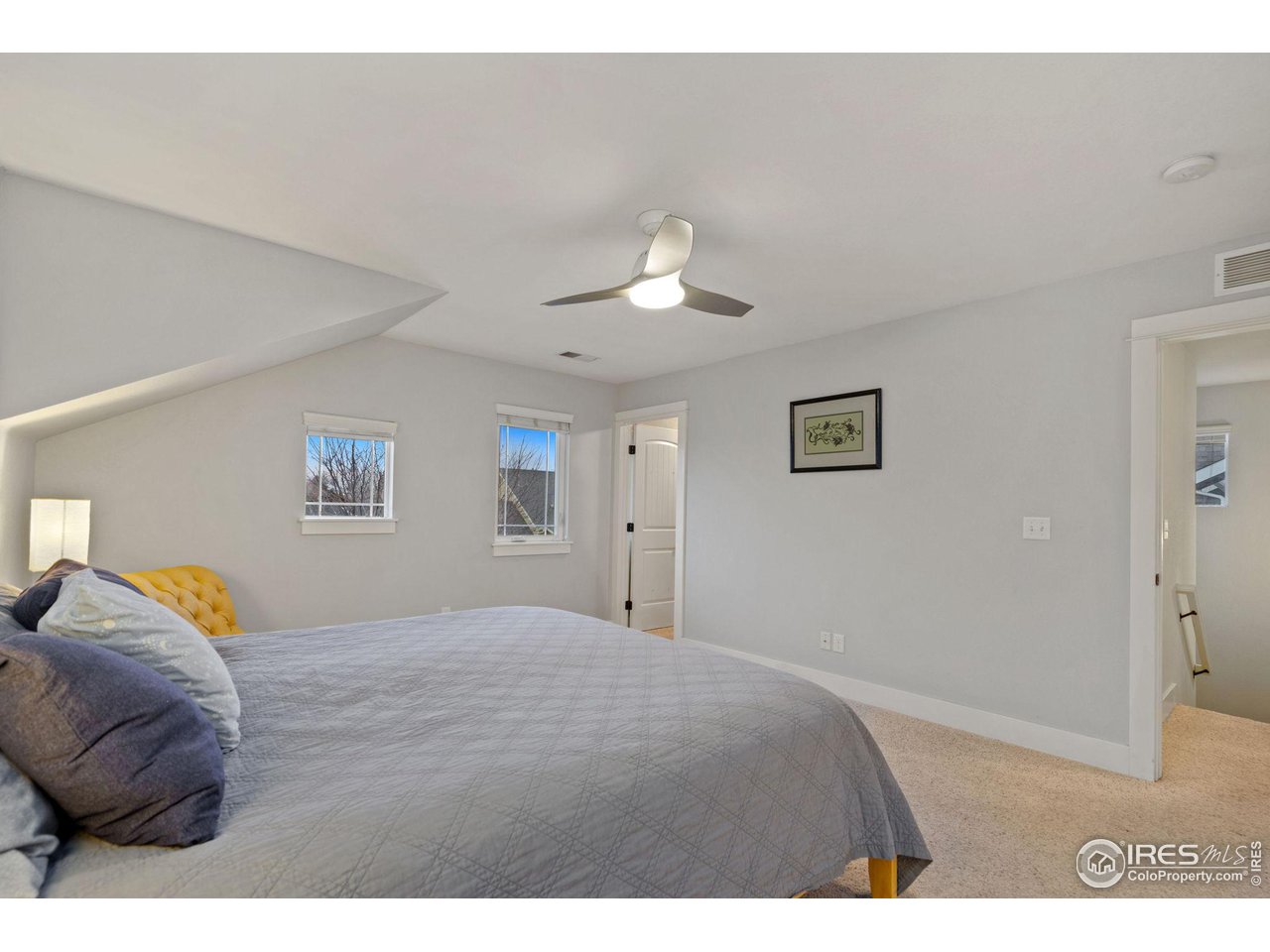2263 Bellwether Lane Fort Collins, CO 80521 - Photo 17 of 40 a bedroom with a bed and a painting