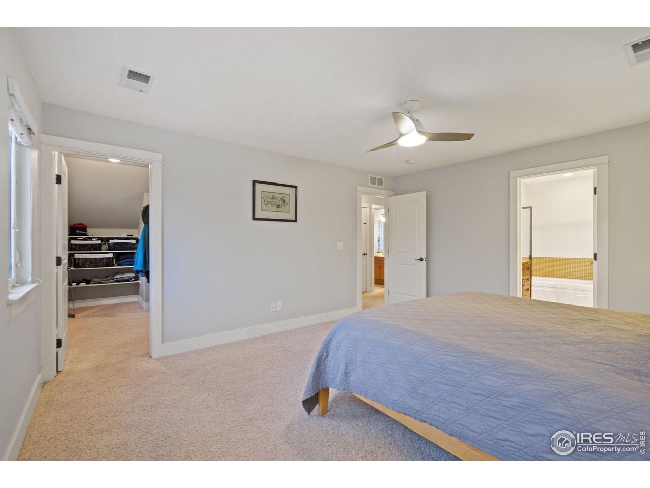 2263 Bellwether Lane Fort Collins, CO 80521 - Photo 18 of 40 a bedroom with a bed and a view of kitchen