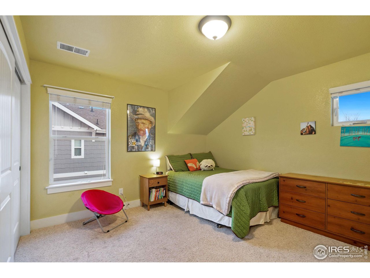 2263 Bellwether Lane Fort Collins, CO 80521 - Photo 23 of 40 a bedroom with a bed and wooden floor