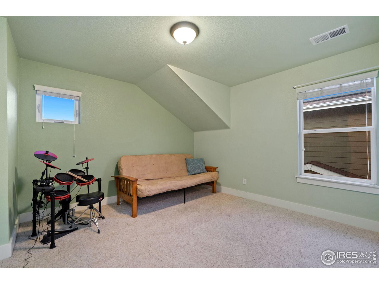 2263 Bellwether Lane Fort Collins, CO 80521 - Photo 25 of 40 a living room with furniture and a window