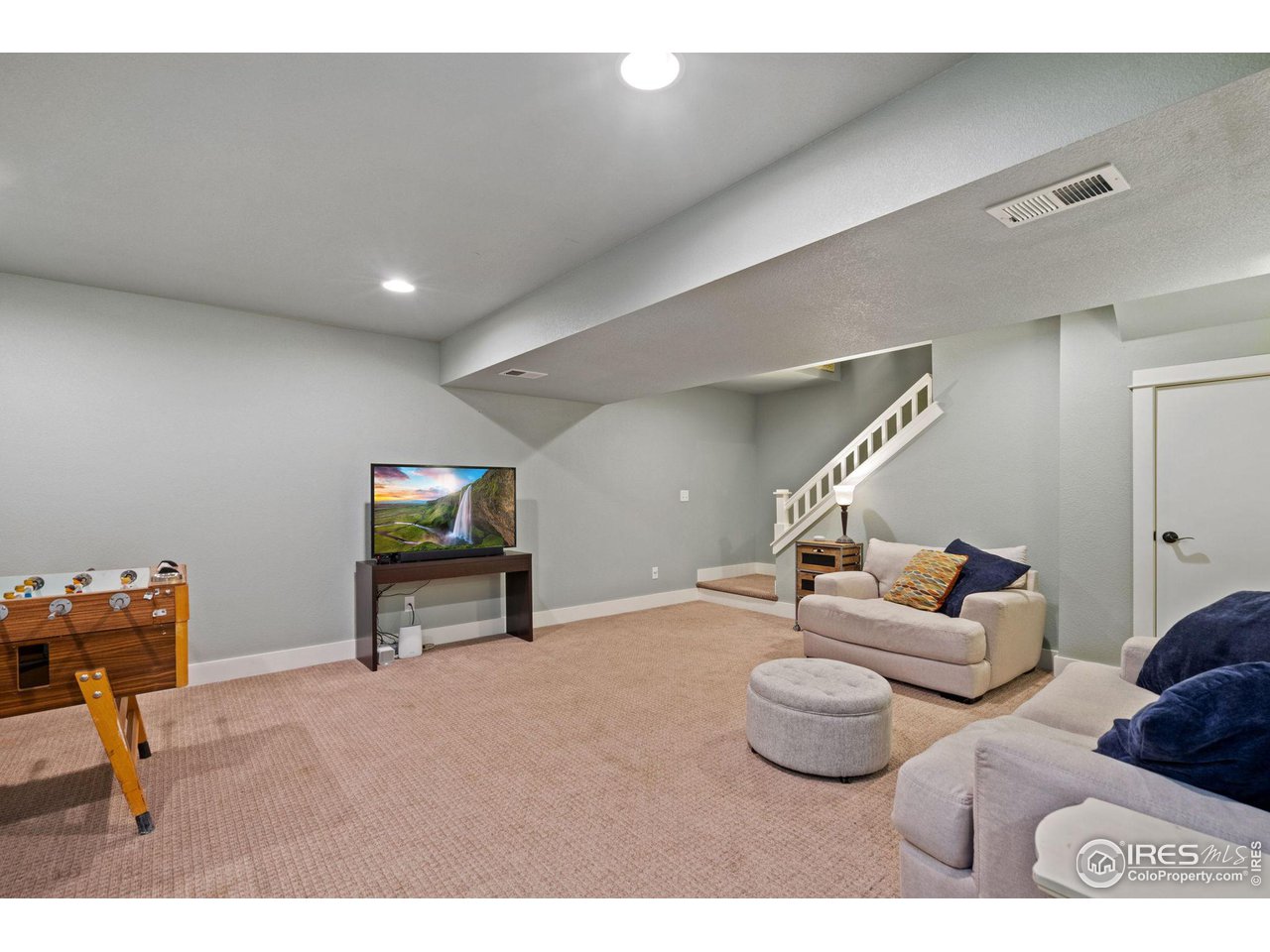 2263 Bellwether Lane Fort Collins, CO 80521 - Photo 29 of 40 a living room with furniture and a wall painting