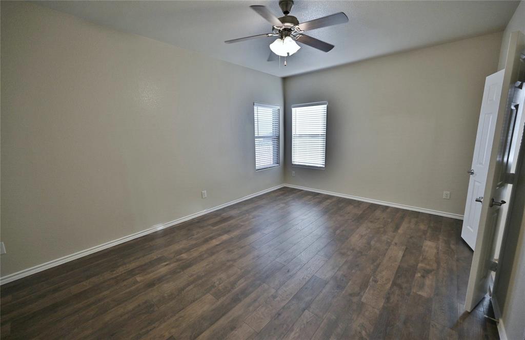 916 Iona Drive Fort Worth, TX 76120 - Photo 19 of 40 Primary Bedroom