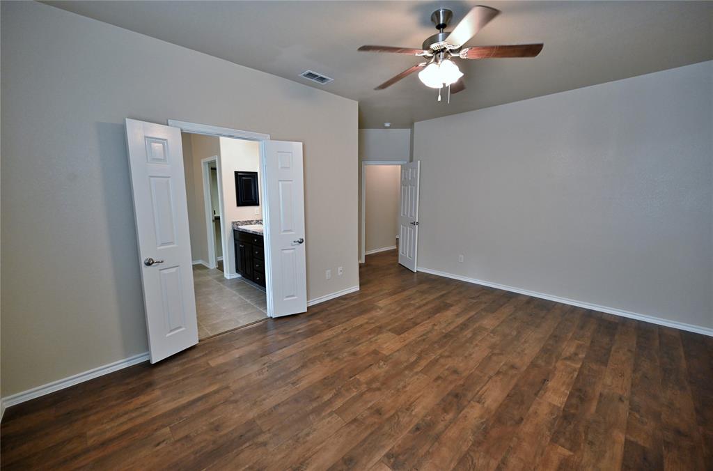 916 Iona Drive Fort Worth, TX 76120 - Photo 20 of 40 Primary Bedroom