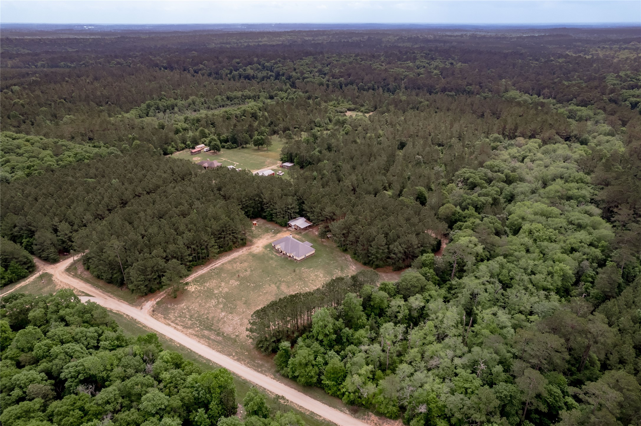 3134 Nursery Road Livingston, TX 77351 - Photo 2 of 50 Situated on just under 48 sprawling acres, backing up to the Alabama-Coushatta Reservation.
