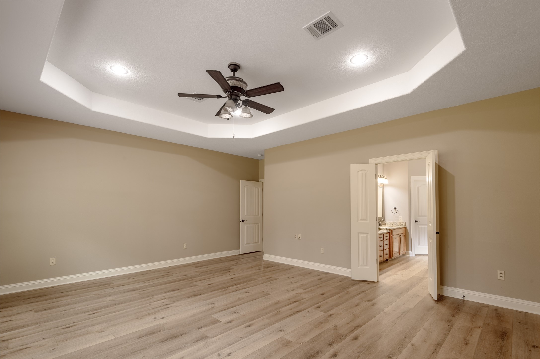 3134 Nursery Road Livingston, TX 77351 - Photo 21 of 50 a view of a big room with wooden floor and a ceiling fan