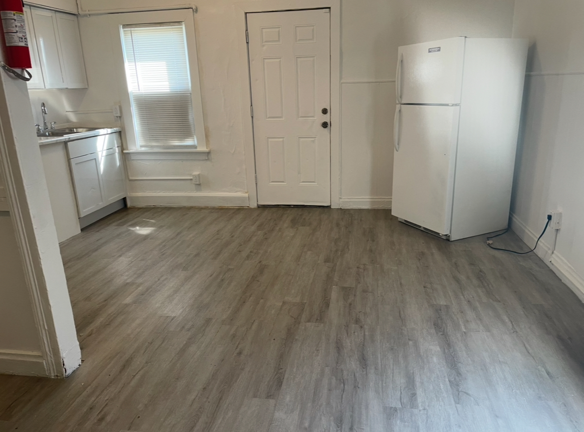 17104 Wentworth Avenue, Unit 6 Lansing, IL 60438 - Photo 3 of 8 a view of empty room with wooden floor and electronic appliances