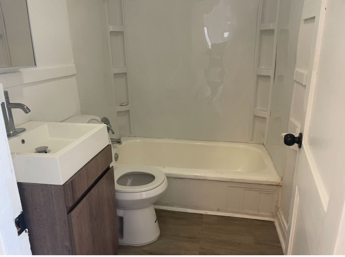 17104 Wentworth Avenue, Unit 6 Lansing, IL 60438 - Photo 4 of 8 a bathroom with a sink and a toilet