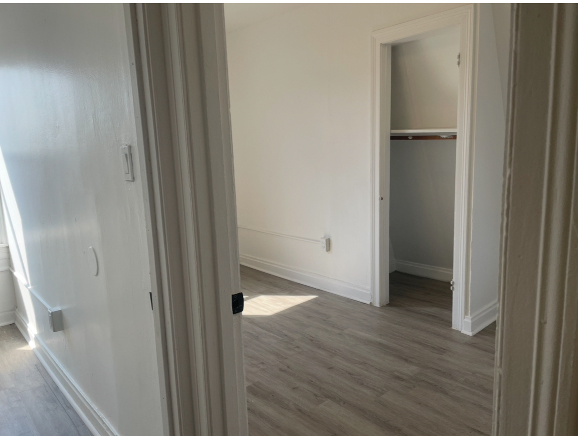 17104 Wentworth Avenue, Unit 6 Lansing, IL 60438 - Photo 6 of 8 a view of a hallway with wooden floor
