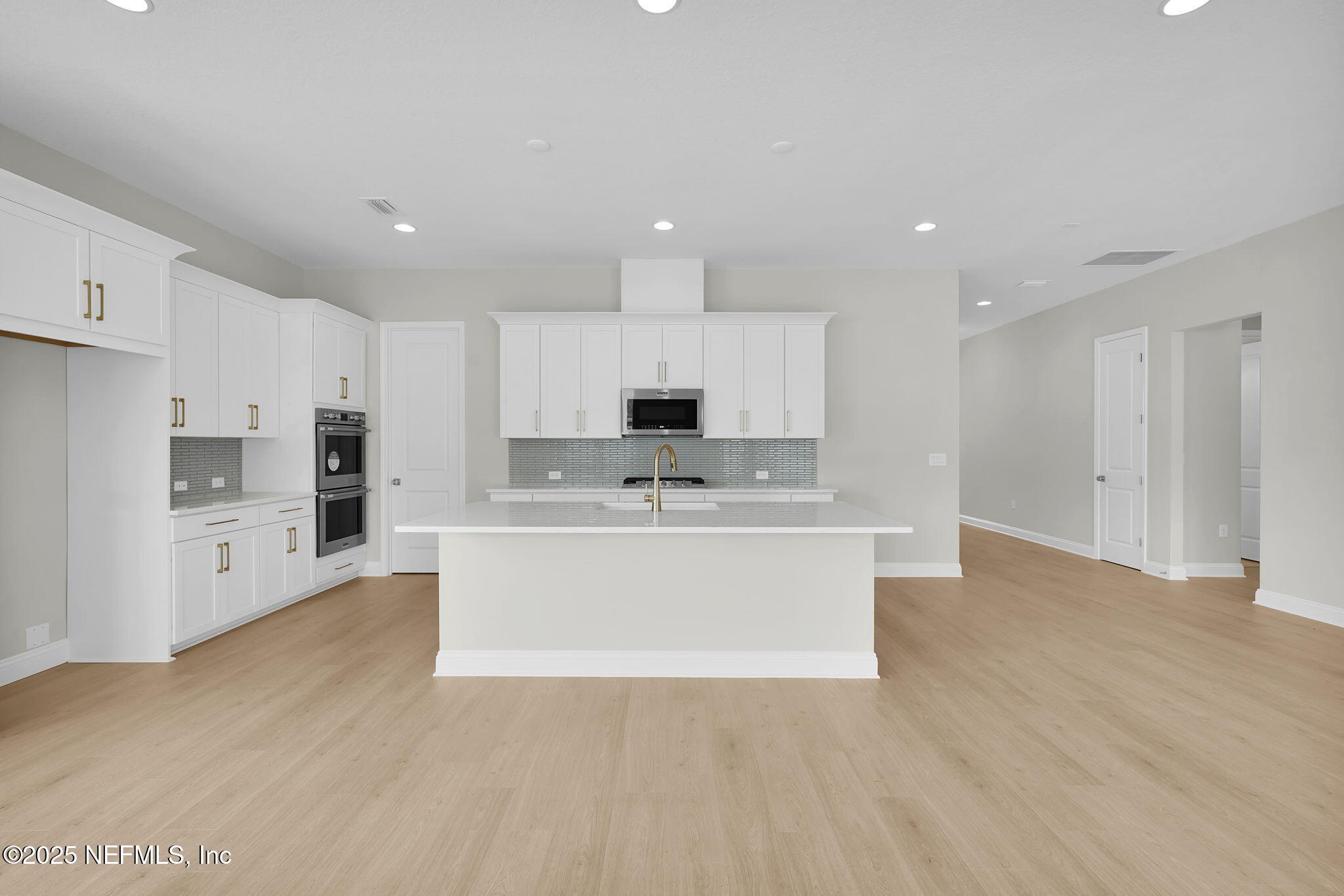 440 Slash Pine Place Yulee, FL 32097 - Photo 16 of 38 a view of kitchen with kitchen island sink stainless steel appliances and cabinets