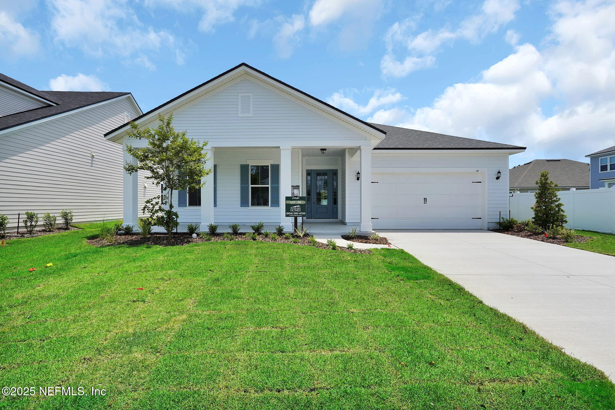 440 Slash Pine Place Yulee, FL 32097 - Photo 2 of 38 a front view of house with yard and outdoor seating