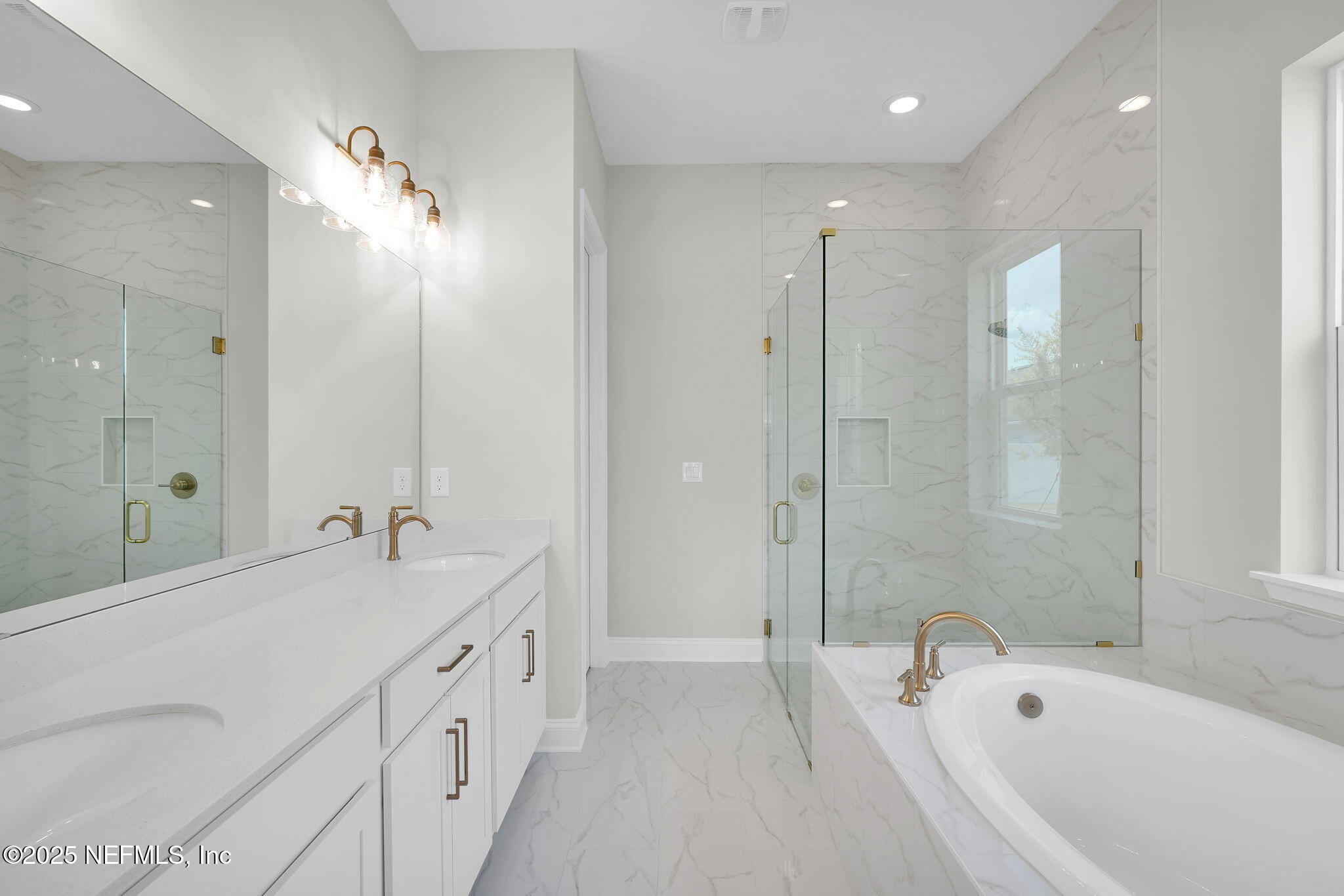 440 Slash Pine Place Yulee, FL 32097 - Photo 28 of 38 a spacious bathroom with a tub sink shower and mirror