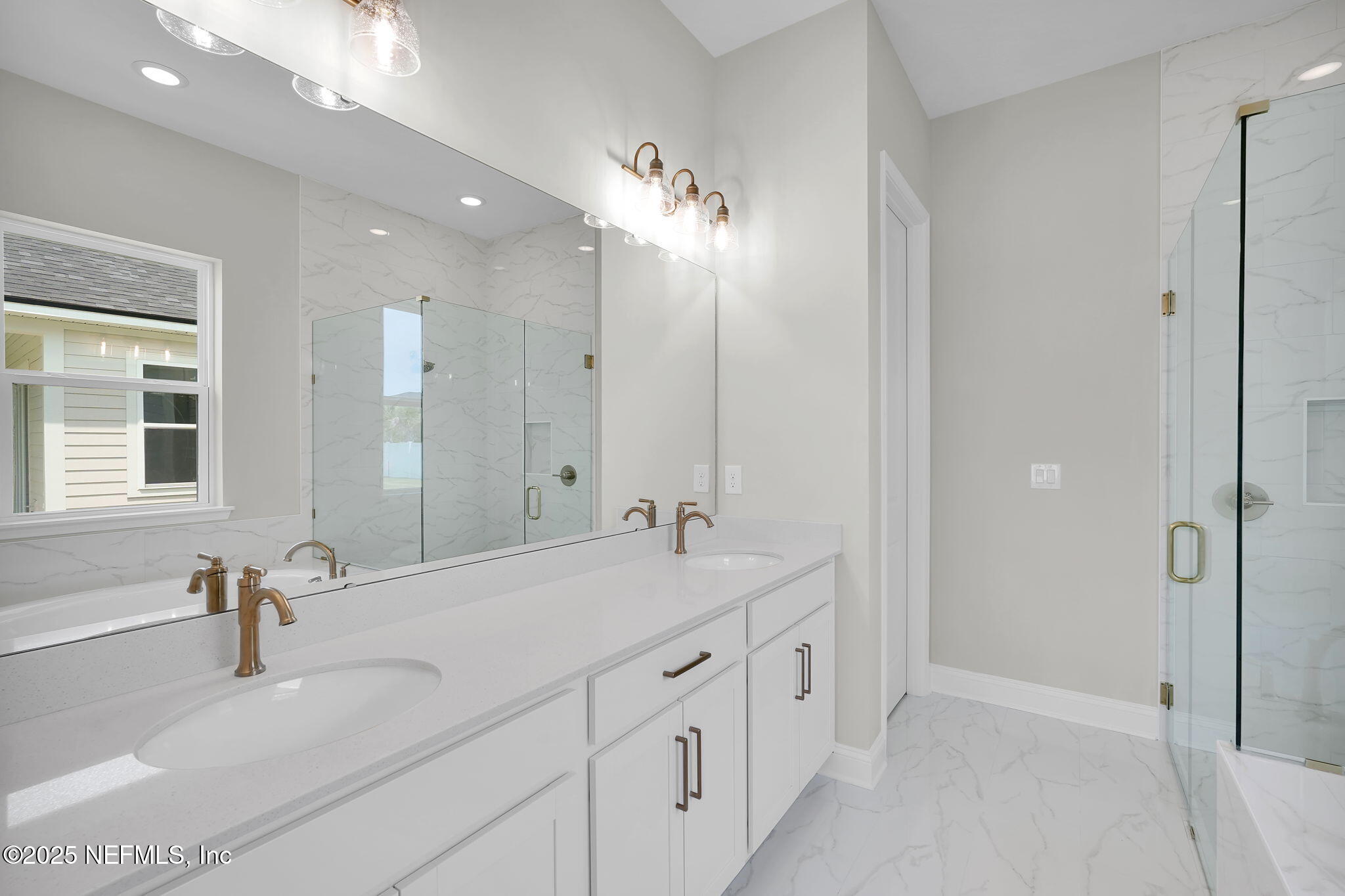 440 Slash Pine Place Yulee, FL 32097 - Photo 29 of 38 a bathroom with double vanity sinks and a shower