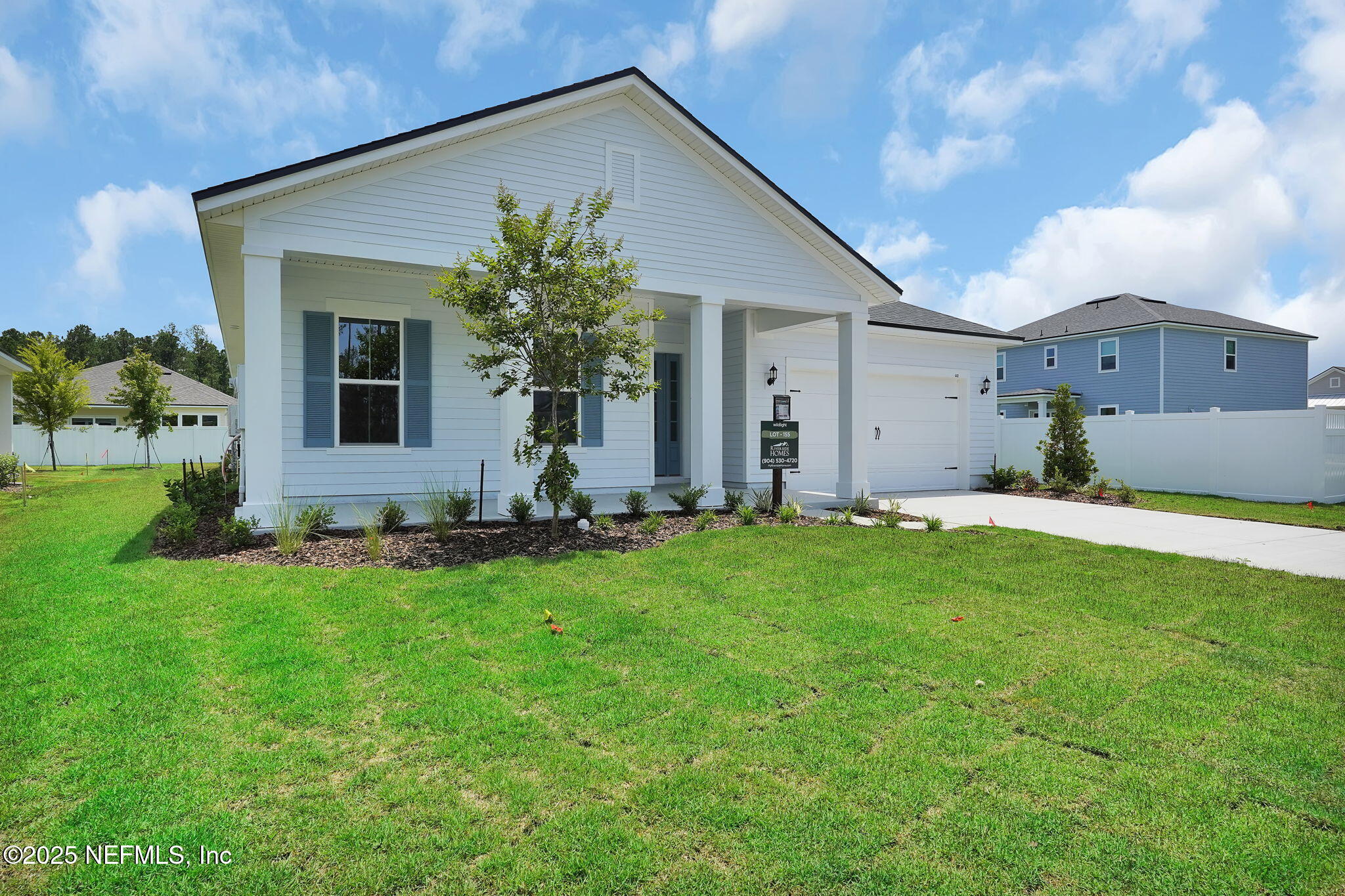 440 Slash Pine Place Yulee, FL 32097 - Photo 3 of 38 a view of a house with backyard and garden