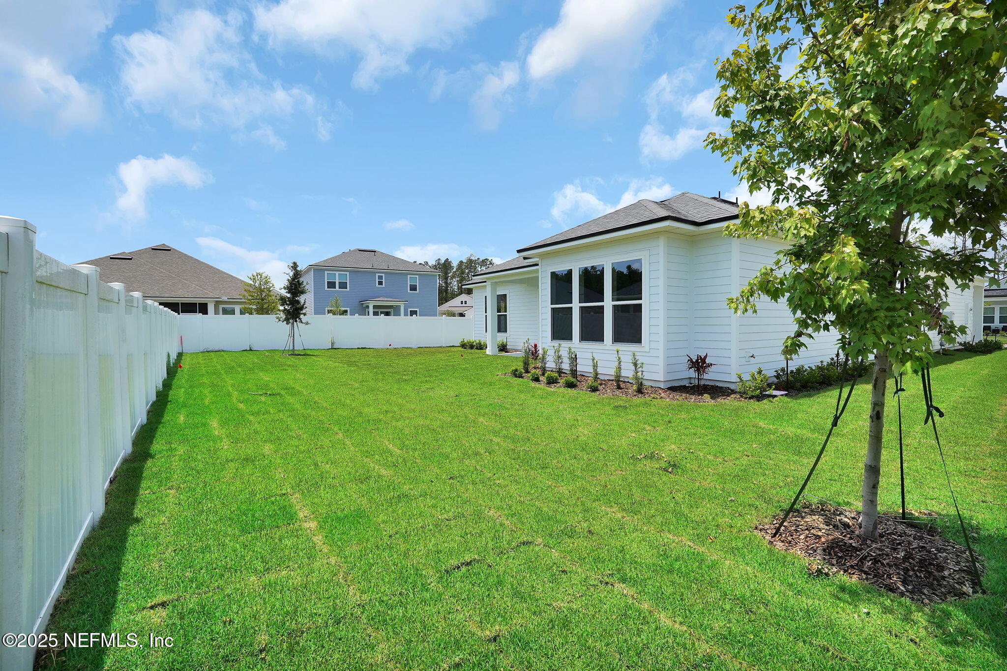 440 Slash Pine Place Yulee, FL 32097 - Photo 35 of 38 a view of a house with a backyard