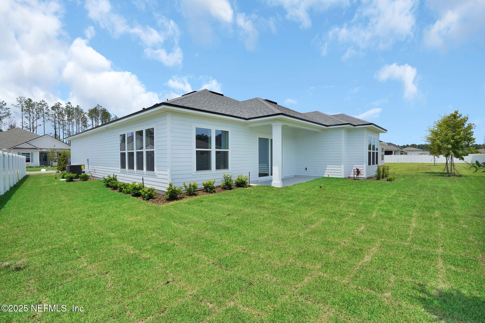 440 Slash Pine Place Yulee, FL 32097 - Photo 37 of 38 a front view of house with yard and green space