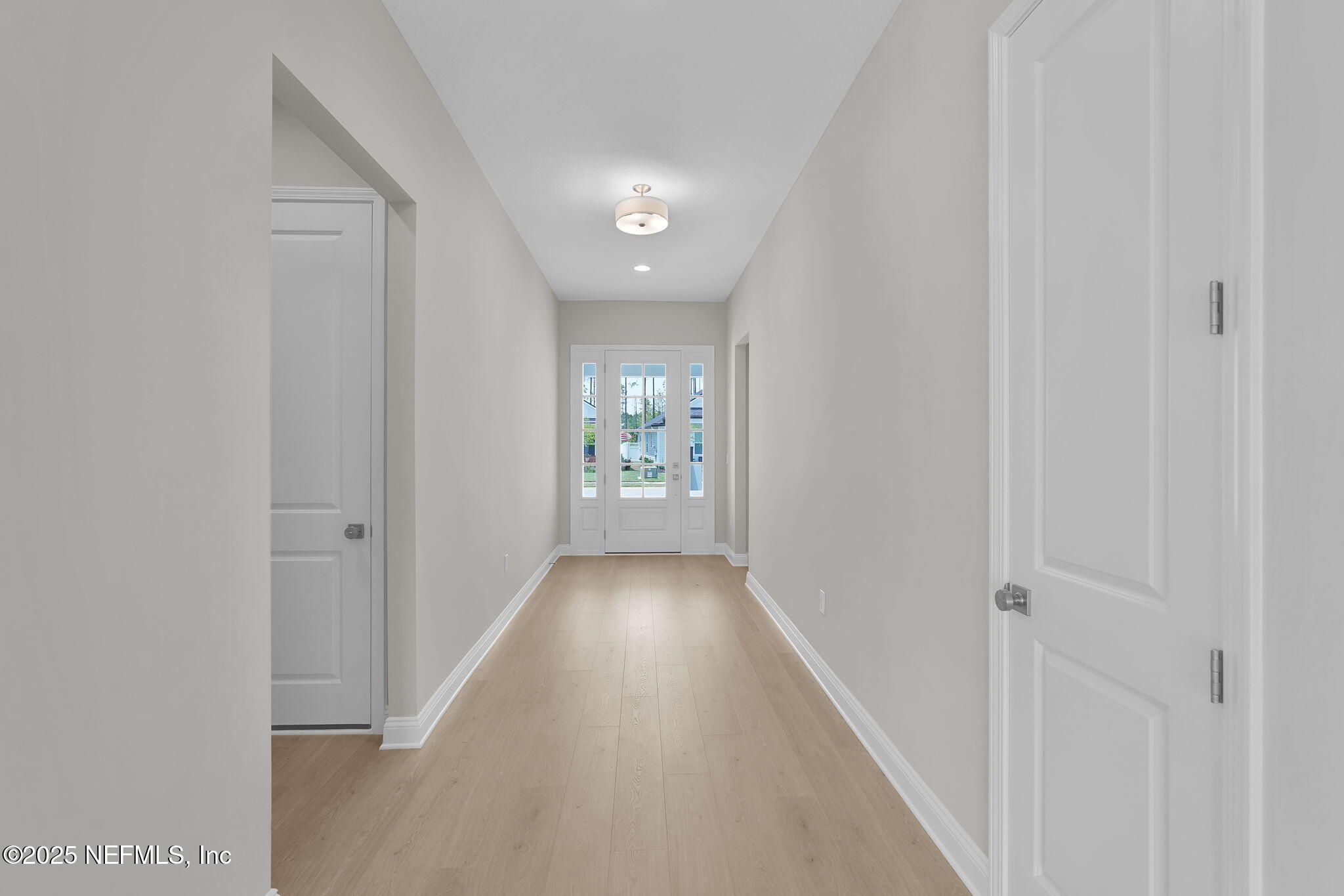 440 Slash Pine Place Yulee, FL 32097 - Photo 6 of 38 a view of hallway with wooden floor