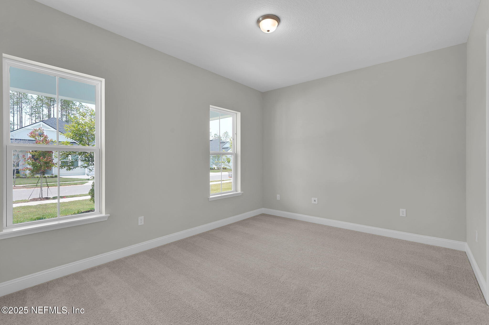 440 Slash Pine Place Yulee, FL 32097 - Photo 7 of 38 an empty room with windows