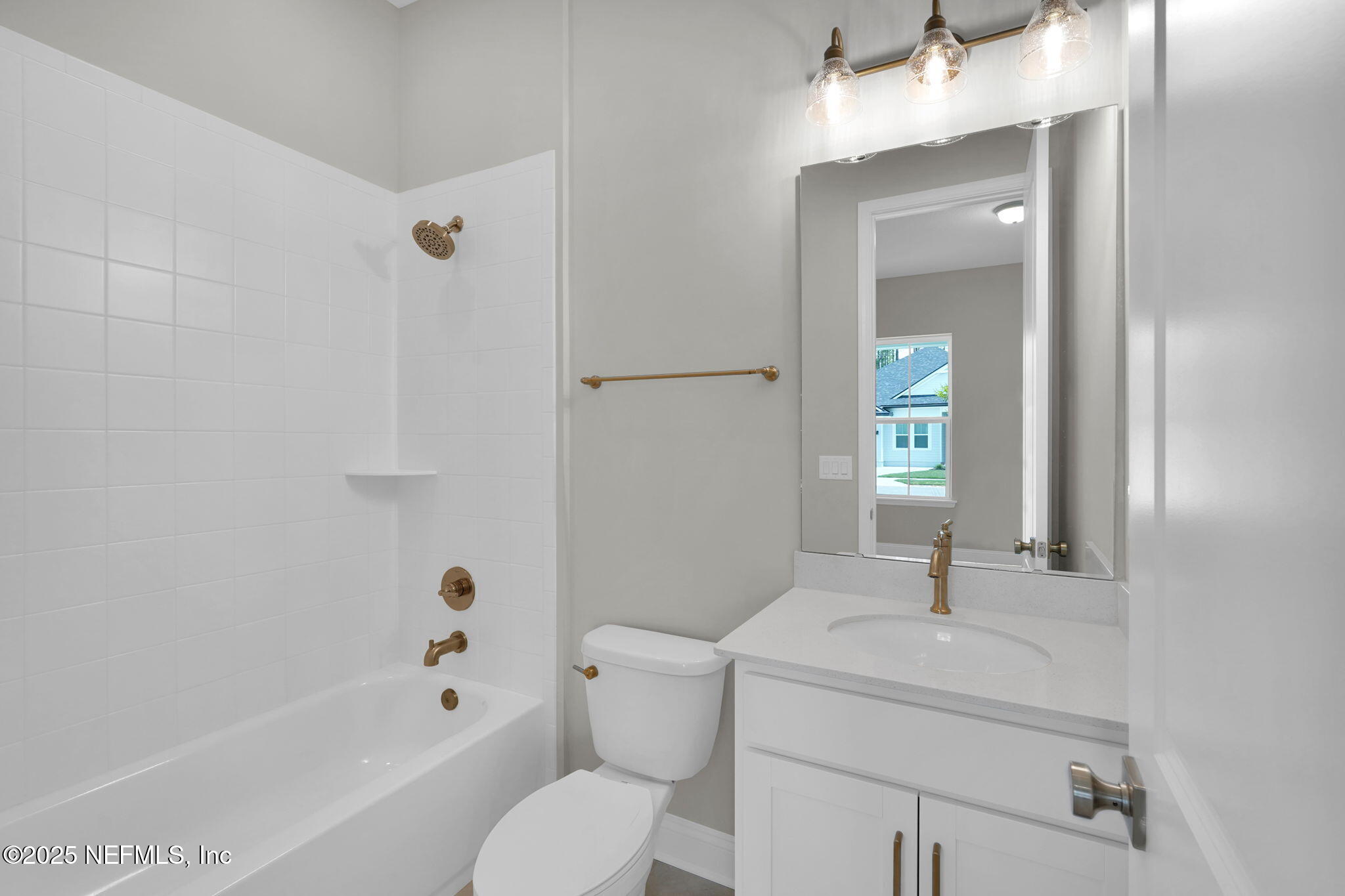 440 Slash Pine Place Yulee, FL 32097 - Photo 9 of 38 a bathroom with a sink toilet and shower