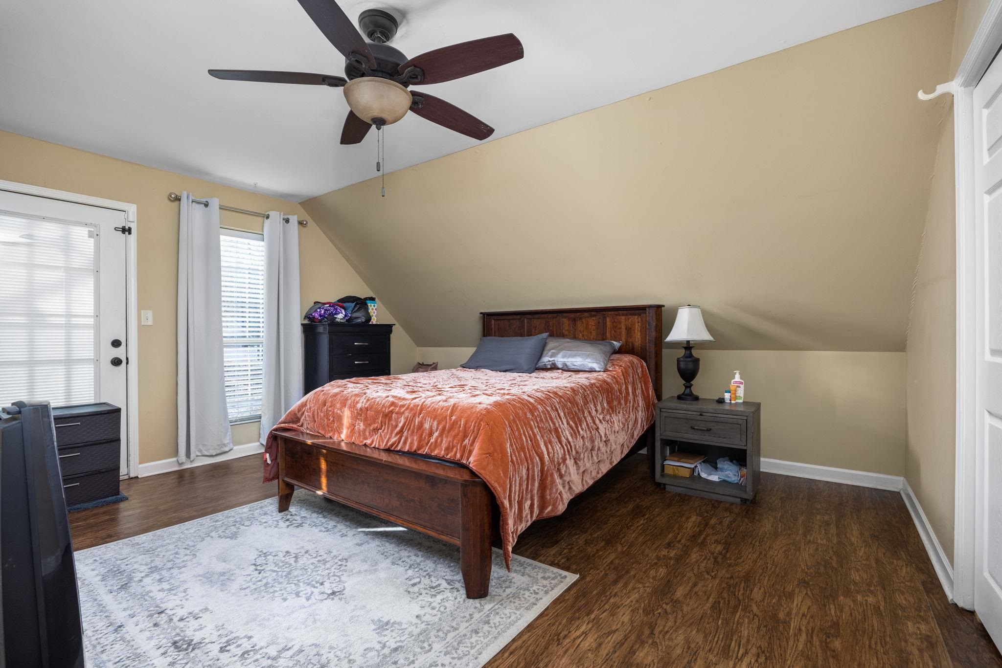 113 Horseshoe Lake Road Saltillo, MS 38866 - Photo 20 of 39 Bedroom with ceiling fan, dark hardwood / wood-style flooring, and lofted ceiling