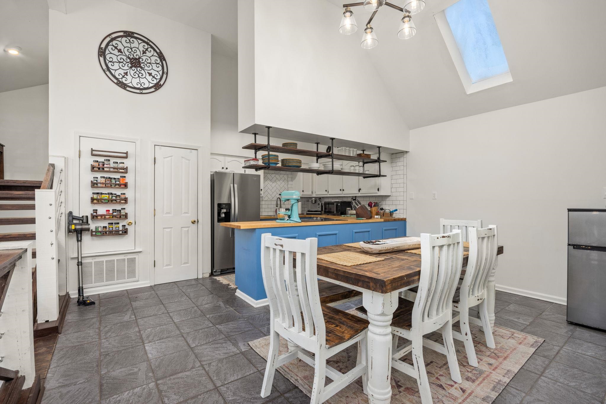 113 Horseshoe Lake Road Saltillo, MS 38866 - Photo 8 of 39 Dining room featuring a skylight and high vaulted ceiling