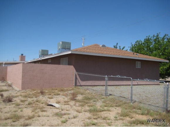 3437 Bacobi Road Golden Valley, AZ 86413 - Photo 5 of 17 a backyard of a house with lots of green space