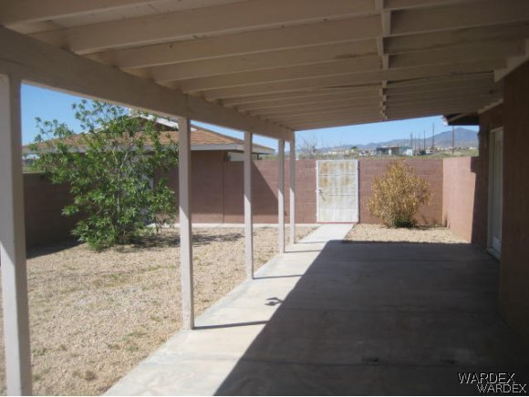3437 Bacobi Road Golden Valley, AZ 86413 - Photo 6 of 17 a view of a porch