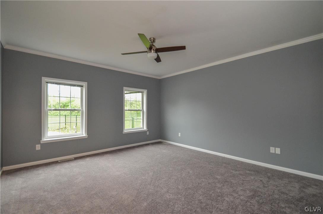 3190 Silver Crest Road Nazareth, PA 18064 - Photo 19 of 50 an empty room with windows and ceiling fan