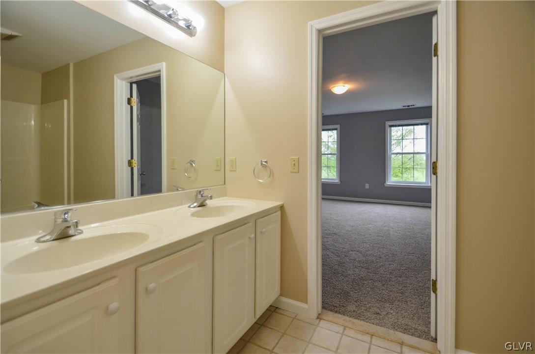 3190 Silver Crest Road Nazareth, PA 18064 - Photo 29 of 50 a bathroom with a granite countertop sink and a mirror