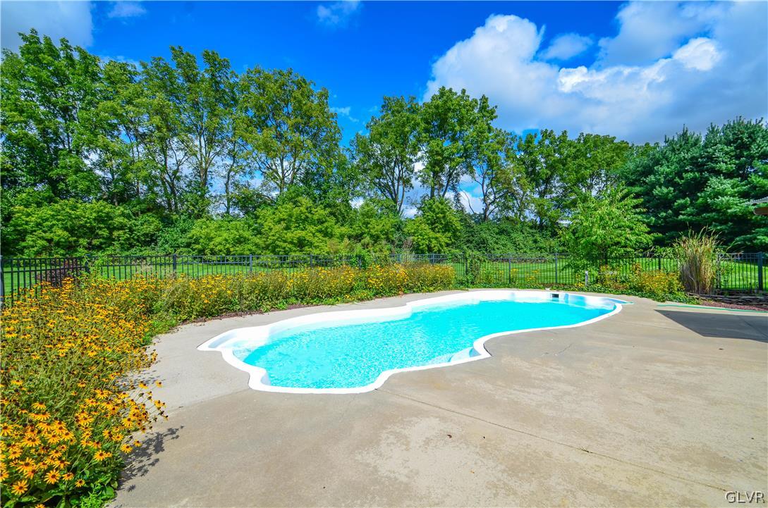 3190 Silver Crest Road Nazareth, PA 18064 - Photo 3 of 50 a view of a swimming pool and a yard