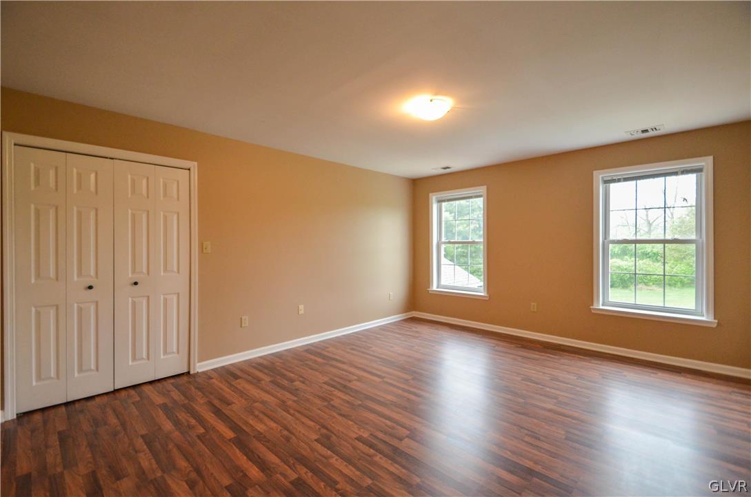 3190 Silver Crest Road Nazareth, PA 18064 - Photo 37 of 50 an empty room with wooden floor and windows