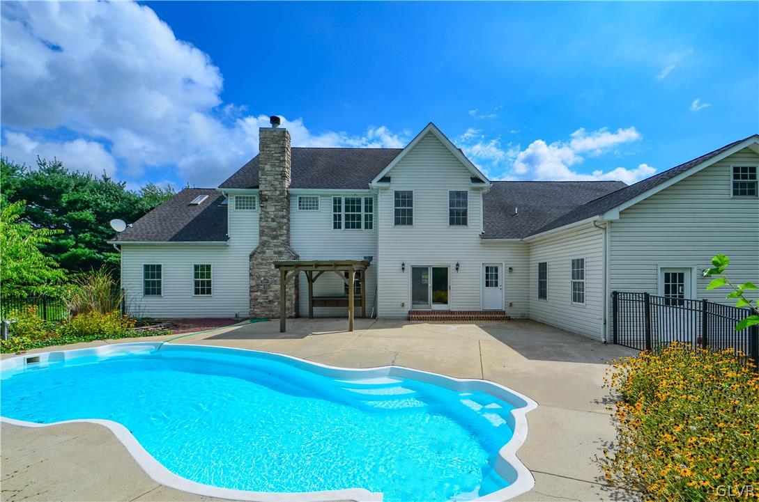 3190 Silver Crest Road Nazareth, PA 18064 - Photo 46 of 50 a view of a house with pool and chairs