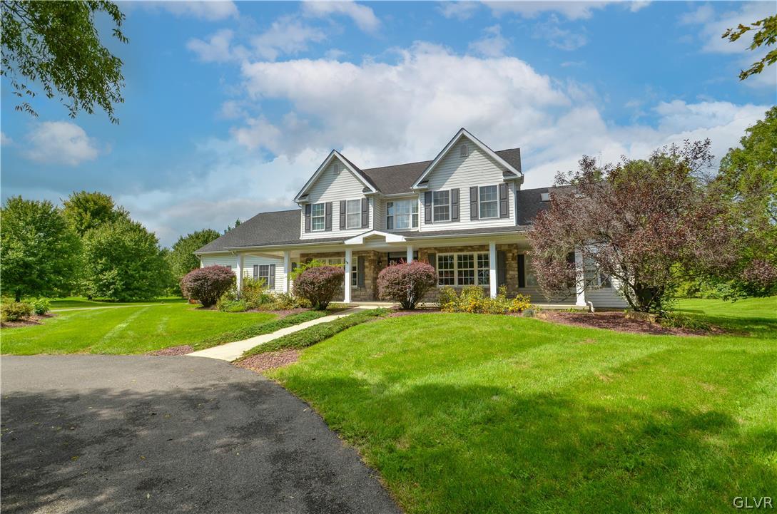 3190 Silver Crest Road Nazareth, PA 18064 - Photo 50 of 50 a front view of a house with a yard table and chairs