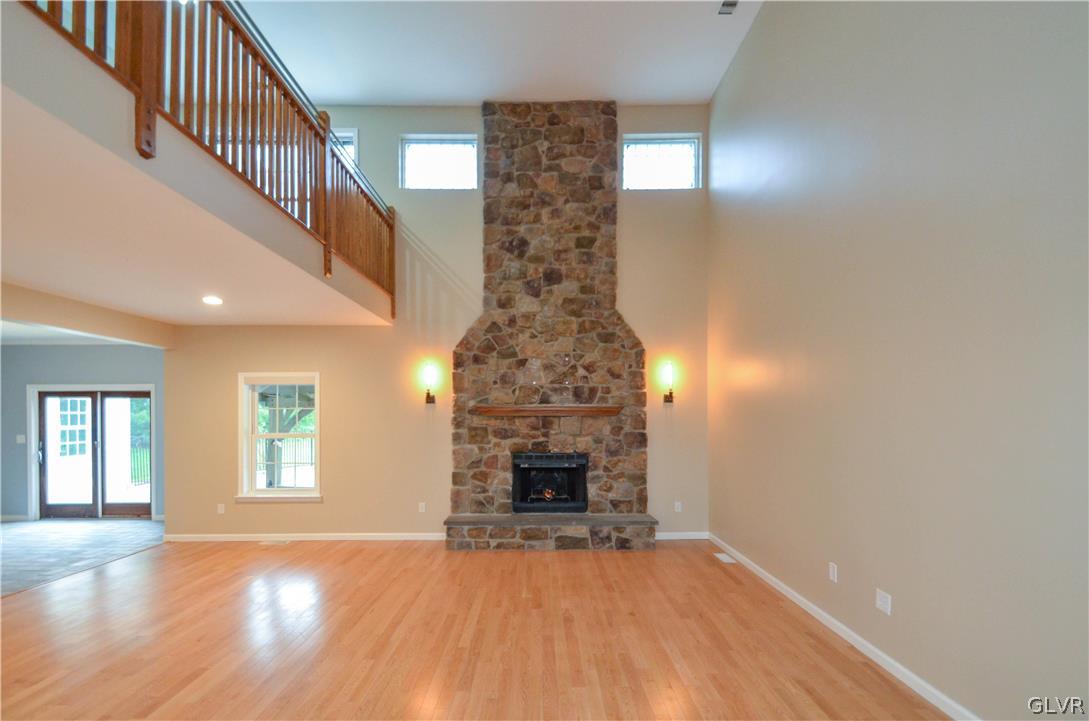 3190 Silver Crest Road Nazareth, PA 18064 - Photo 7 of 50 a view of empty room with wooden floor and fireplace