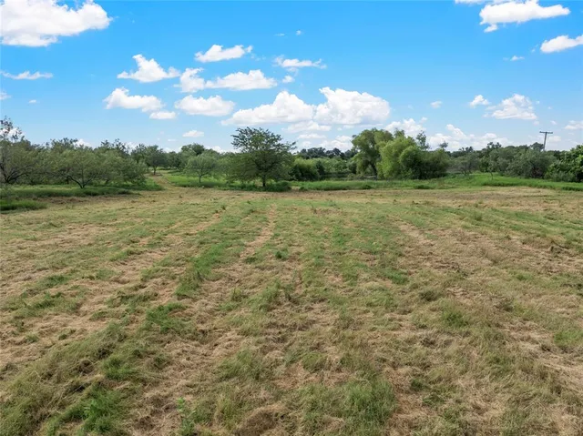 a view of lake with green space