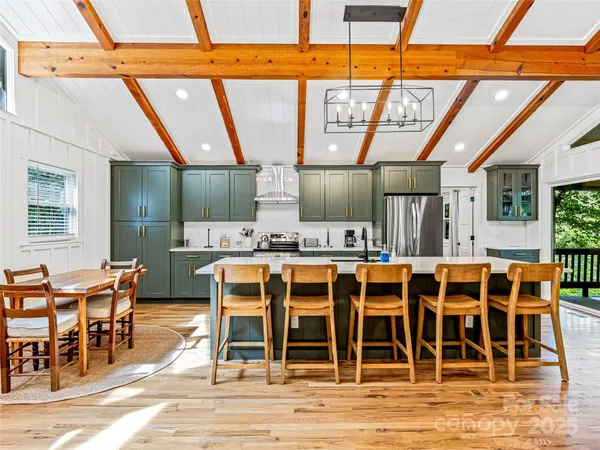 a view of a patio with table and chairs