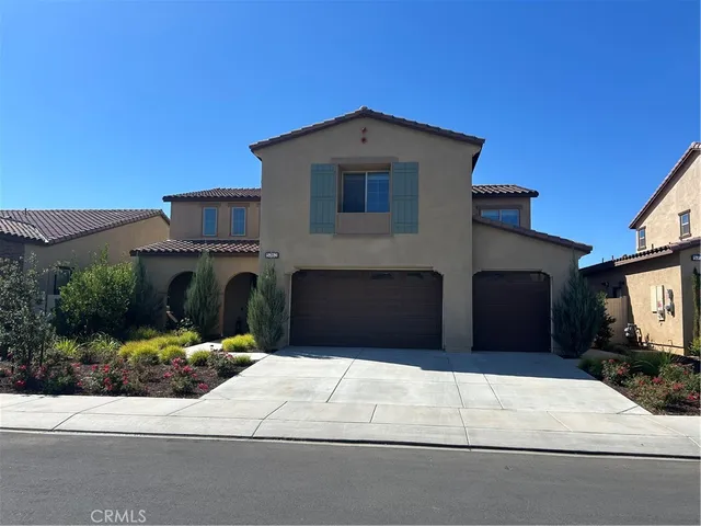 a front view of a house with a garage