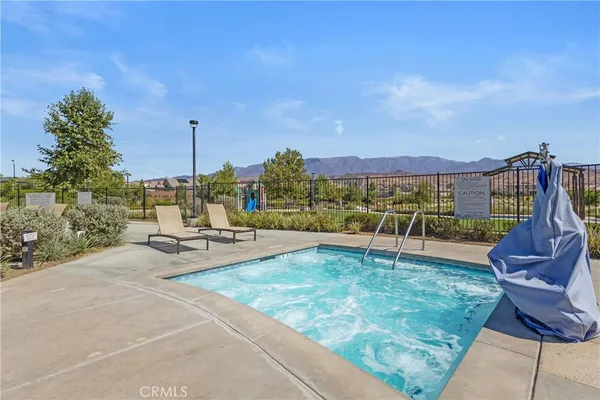 a view of a swimming pool with a lounge chair