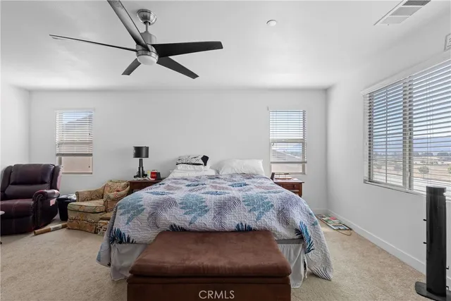 a bedroom with bed and window