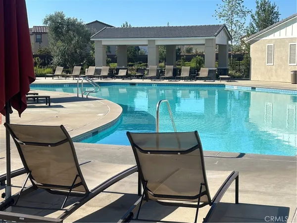 a view of a patio with table and chairs potted plants with wooden floor