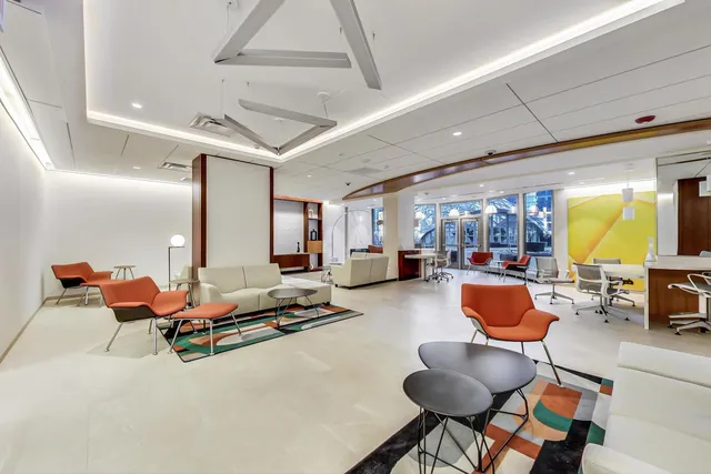 a view of a building with outdoor seating