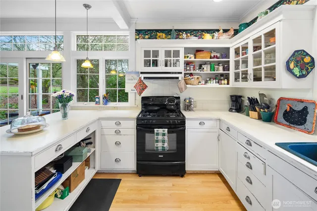 a kitchen with stainless steel appliances granite countertop a stove and a sink
