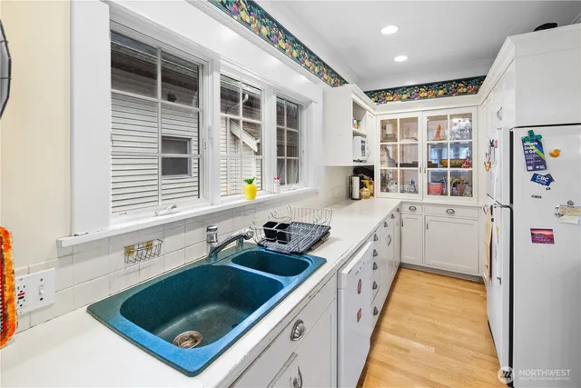 a kitchen that has a sink and a stove